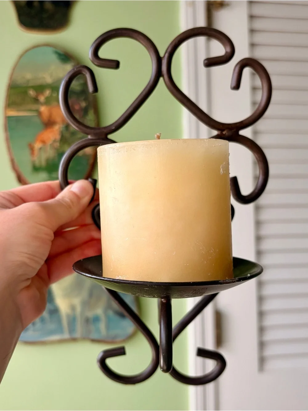 Vintage Metal Scroll Wall Candle Sconce with Cream Pillar Candle